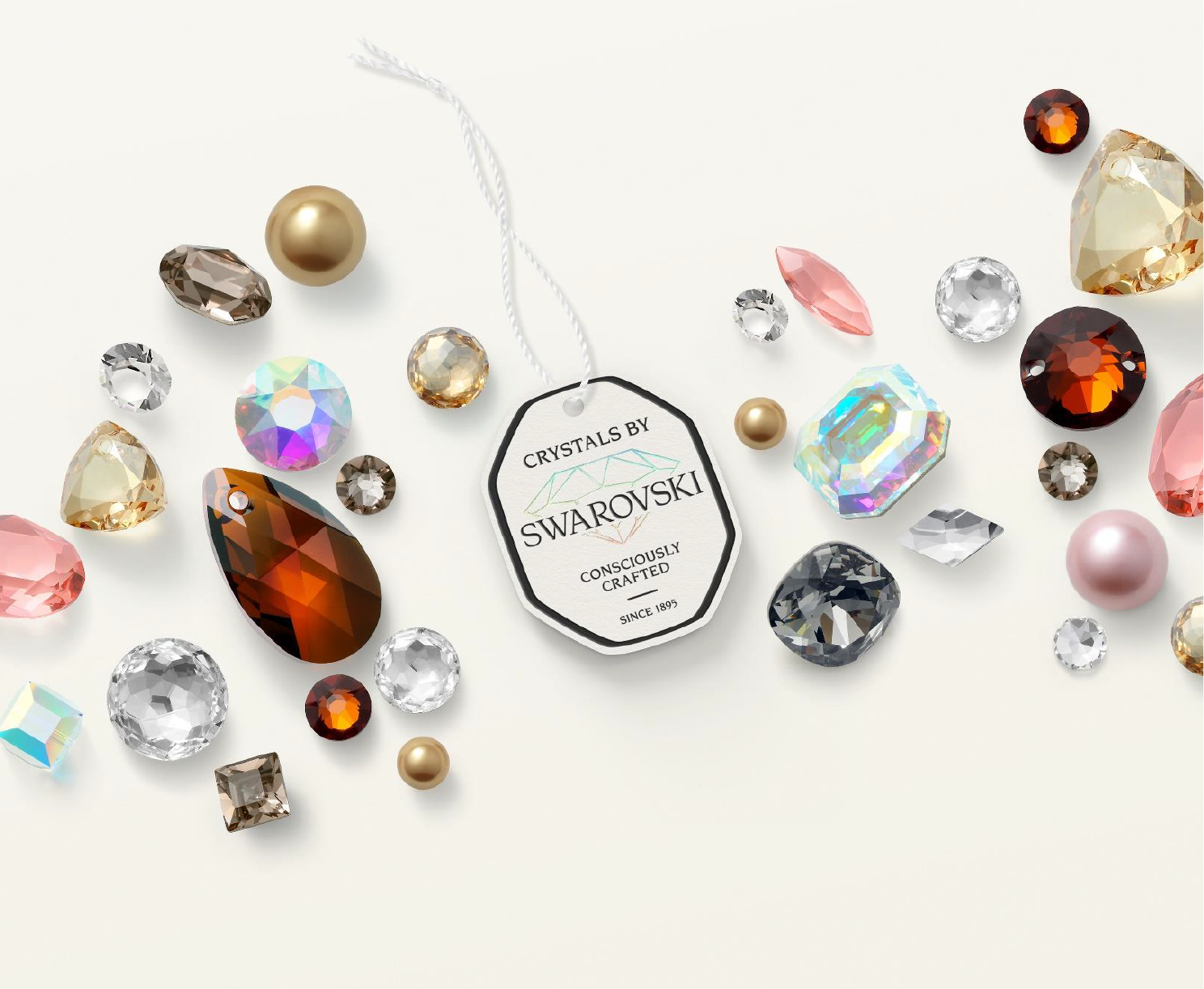 Variety of Swarovski Crystal components on beige background
