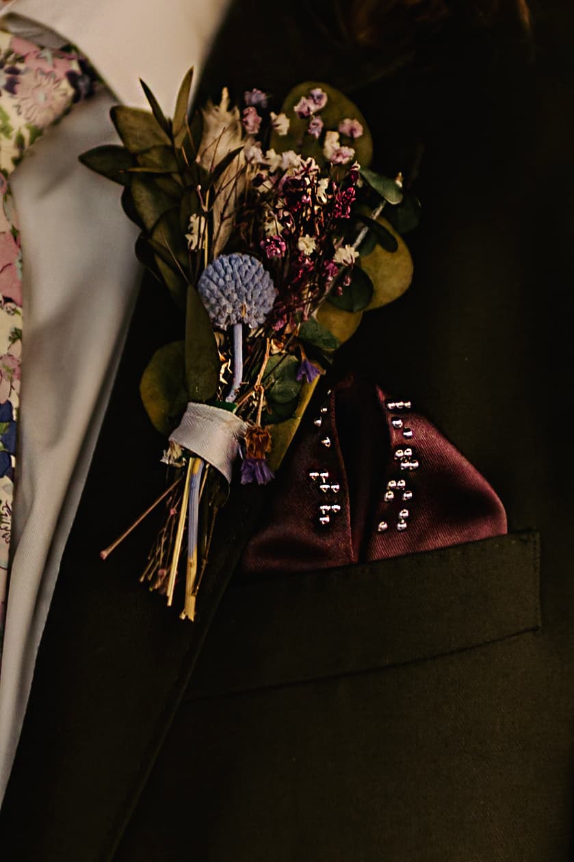 Dark purple pocket square with chrome braille beadwork