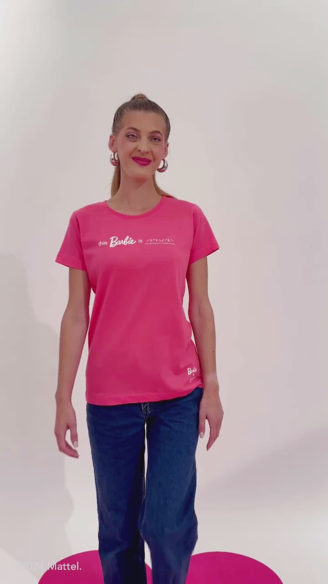 Blind model Chelsea moves around on set to showcase different sides and features of the Barbie braille t-shirt