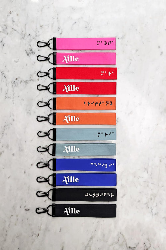 Braille keychains in 6 different colors with white or black braille