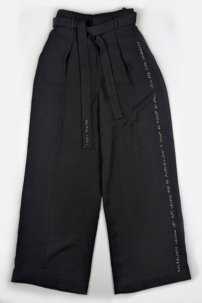 Black high waisted pants with dark grey braille