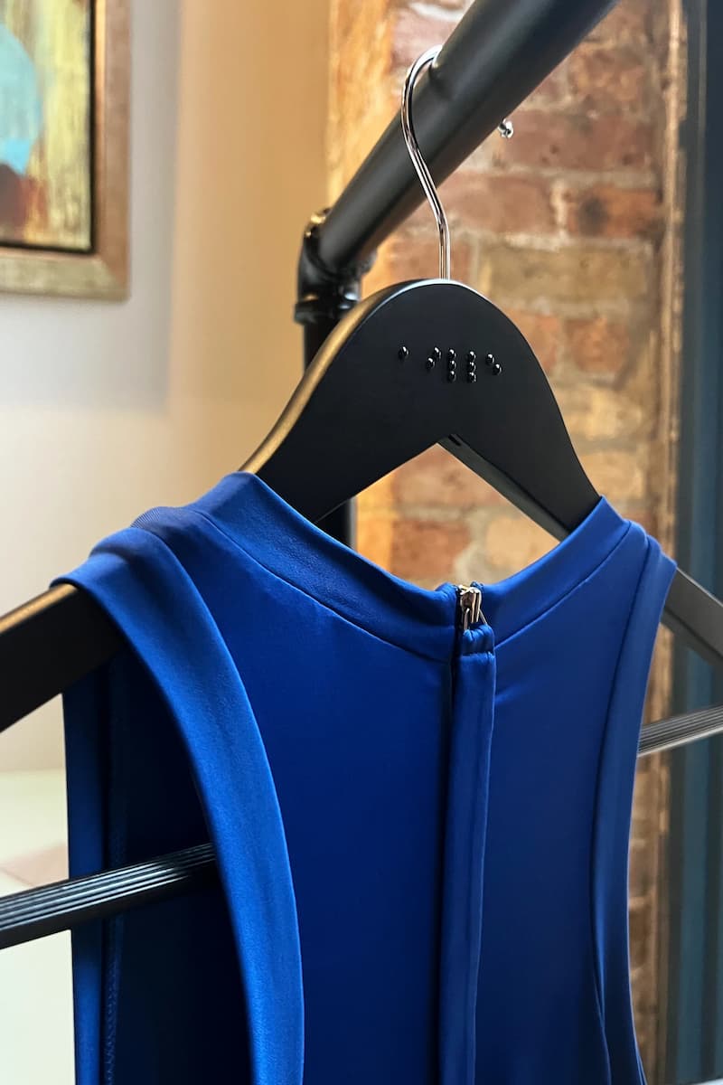 Braille hanger with blue dress
