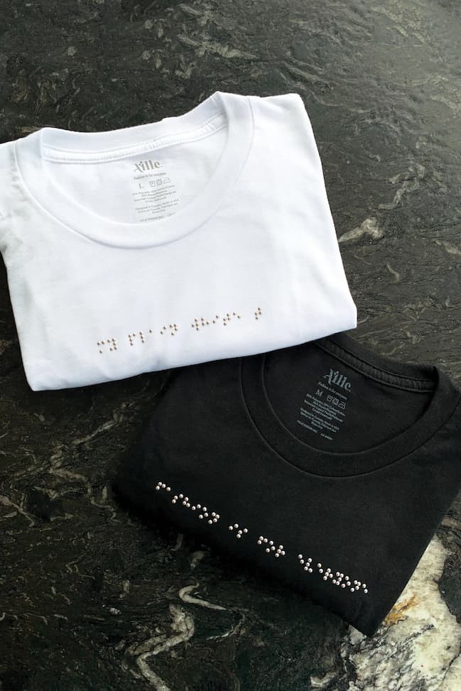 Black and white folded braille t-shirts