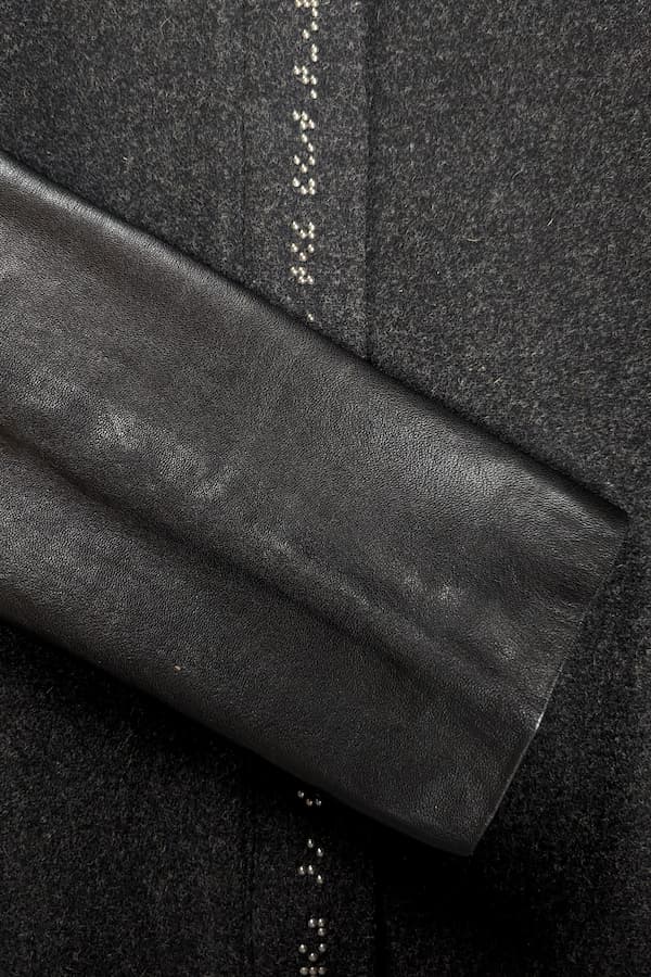 Close up of black leather sleeve on coat