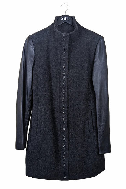 Charcoal grey wool coat with black leather sleeves and dark grey braille beadwork